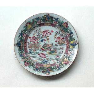 Assiette en porcelaine de Chine à décor de canards et des 8 immortels. Epoque Qianlong 18e s.