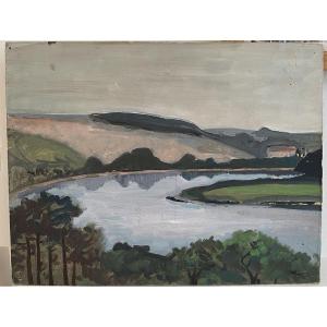 Paysage de rivière et collines. Huile sur carton. XXe siècle.