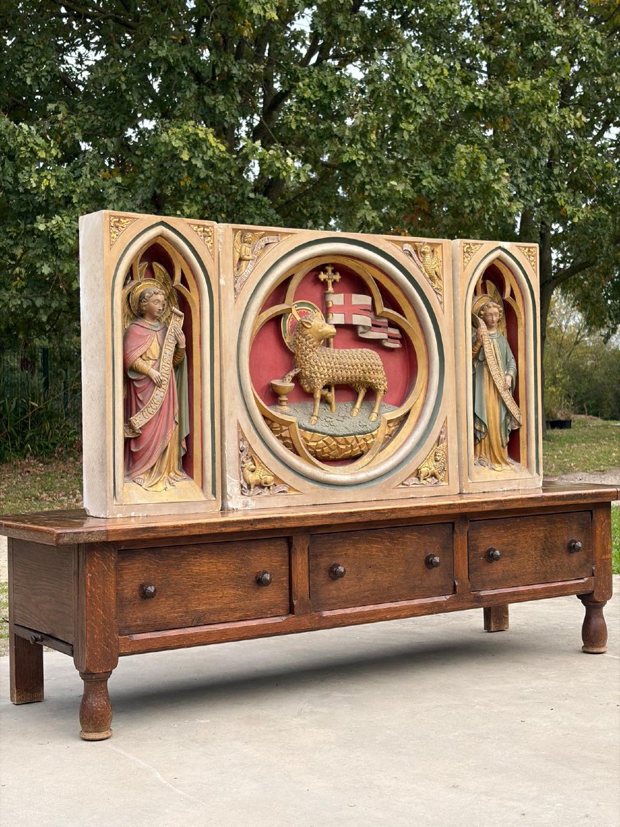 A Stone Altarpiece In The Neo-gothic Style, Adorned With Angels And The Lamb Of God-photo-2