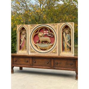 A Stone Altarpiece In The Neo-gothic Style, Adorned With Angels And The Lamb Of God
