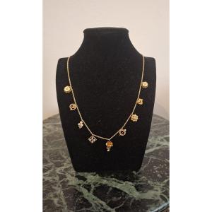 Collier or avec breloques