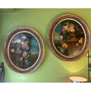 Paire de tableaux ovales bouquets de fleurs 