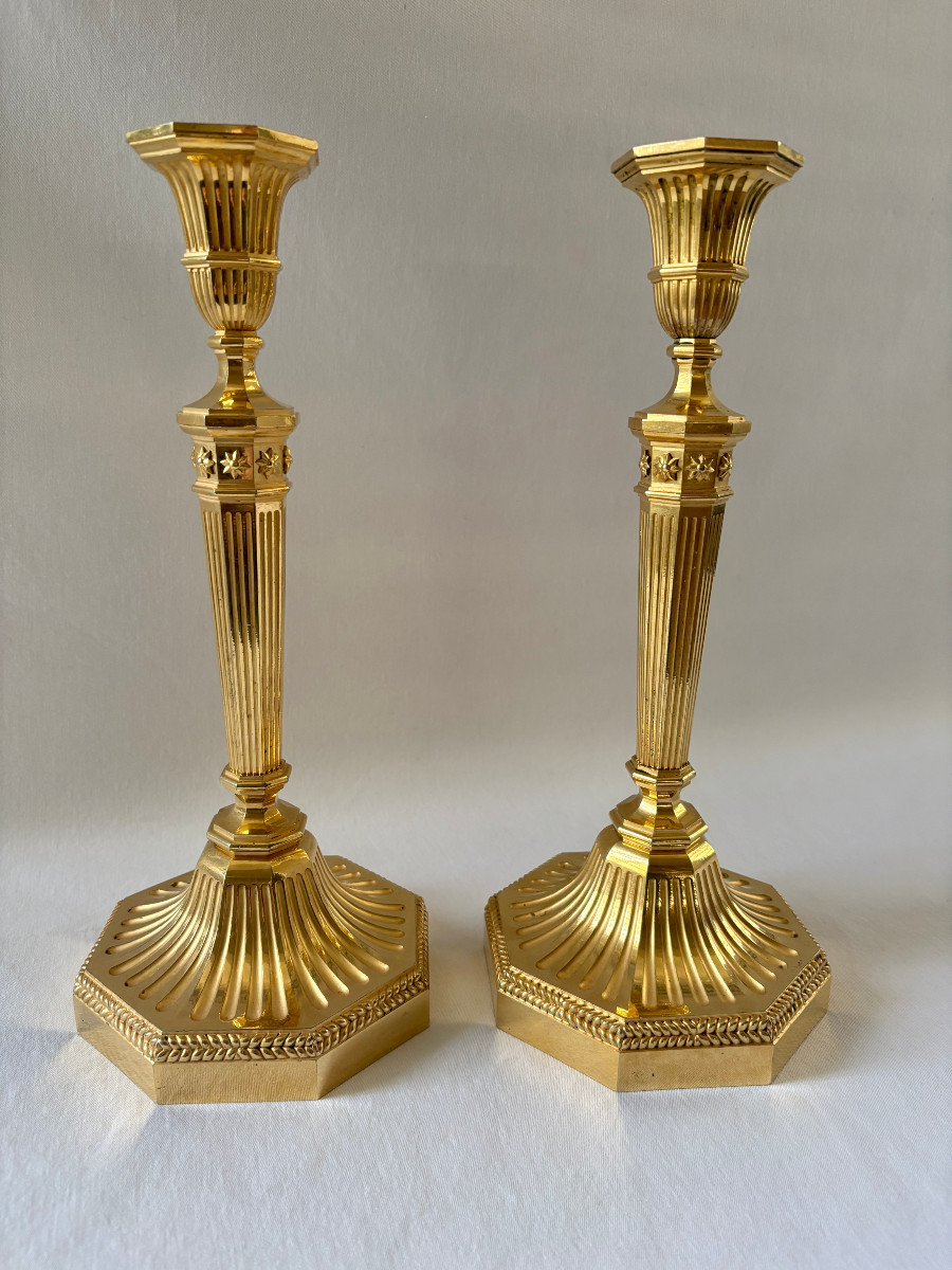 Pair Of Directoire Style Candlesticks In Gilt Bronze