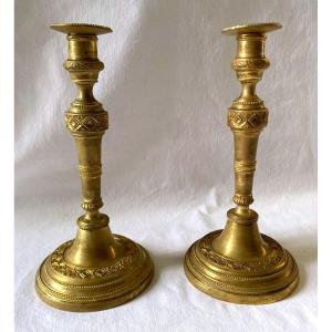 Pair Of Directoire Candlesticks In Chiseled Bronze 