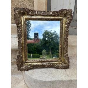 Miroir cadre Louis XIV en bois argenté