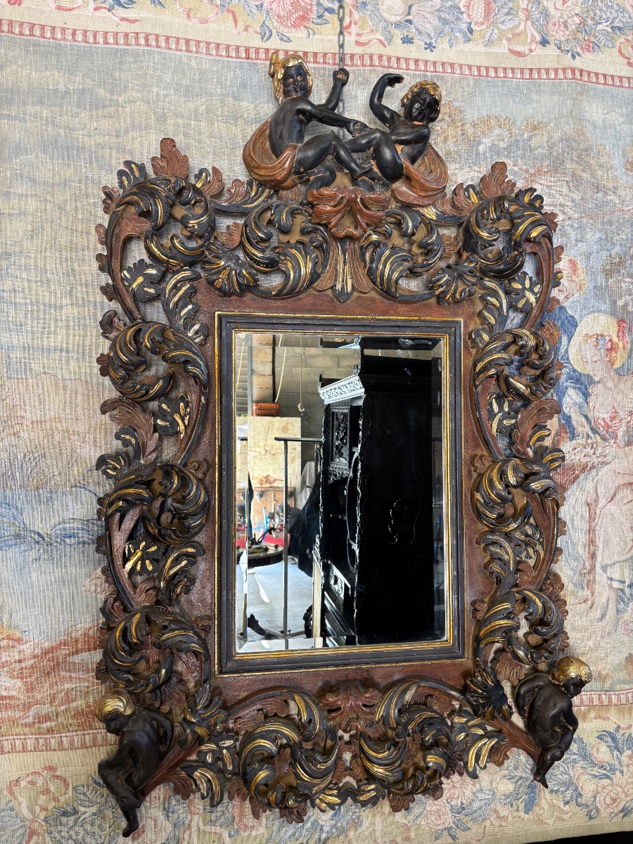Miroir bois sculpté aux chérubins 