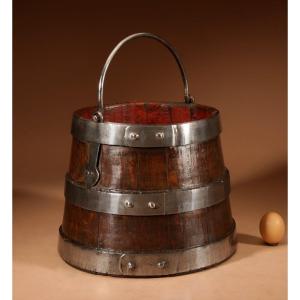 An Oak And Wrought Iron Bound Coopered Ships Bucket.