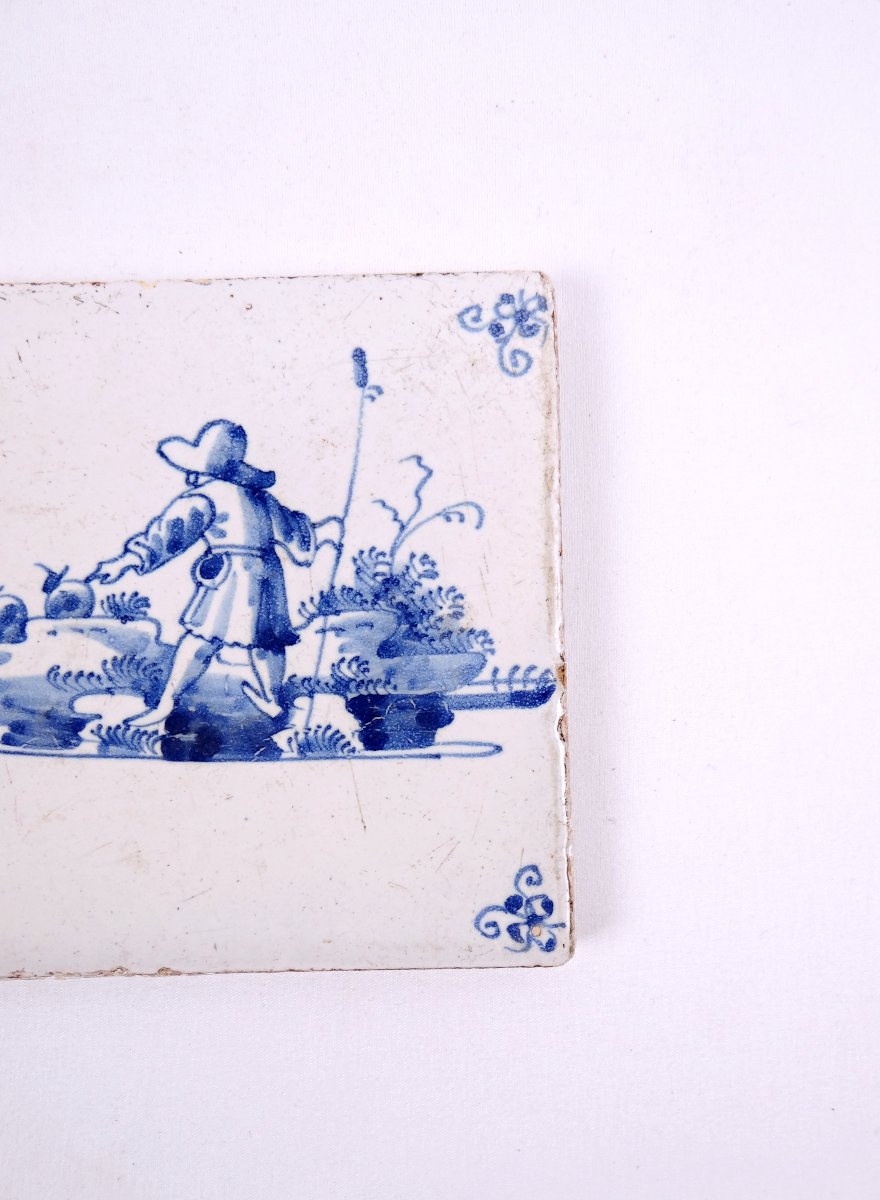 18th-century Delftware Tile Depicting A Peasant Scene With A Farmer Seen From Behind-photo-1