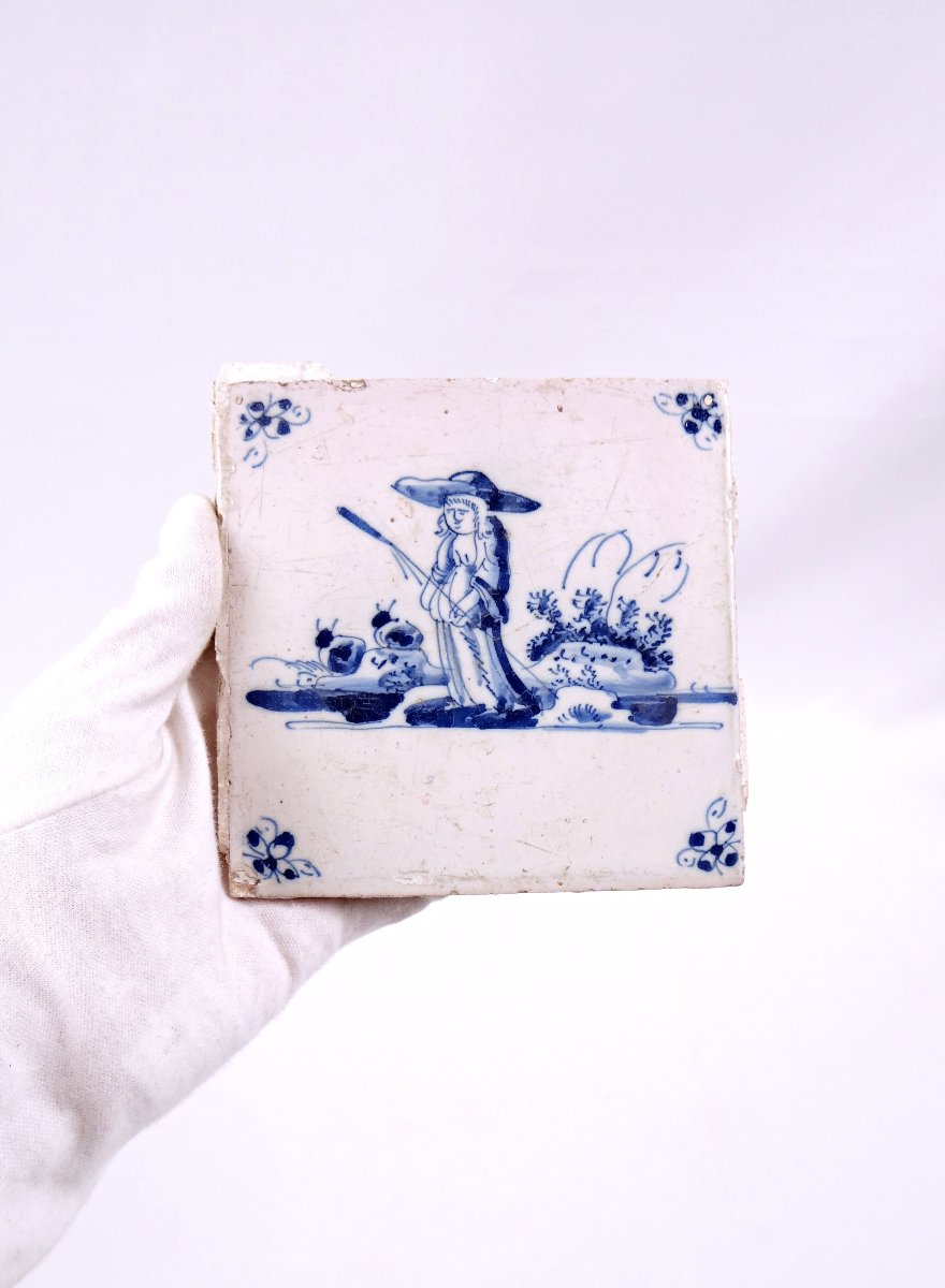 18th-century Delftware Tile Depicting A Peasant Woman With A Stick, Facing Forward-photo-2