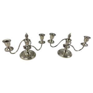Paire de chandeliers en métal argenté 