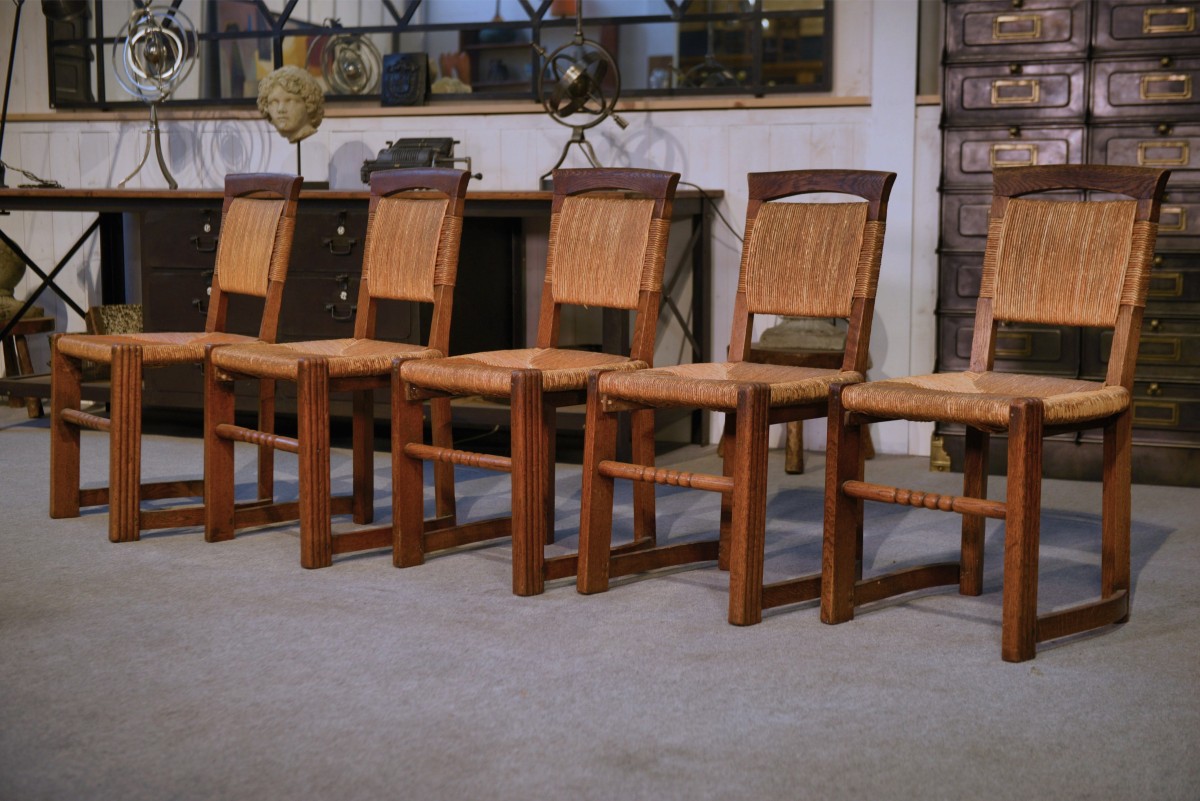 Ensemble de 5 chaises en chêne et jonc dans le goût de Charles Dudouyt 1950's