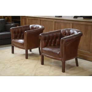 Paire de fauteuils Club capitonnés en cuir