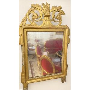 Miroir Louis XVI d’époque XVIIIe en bois sculpté et doré