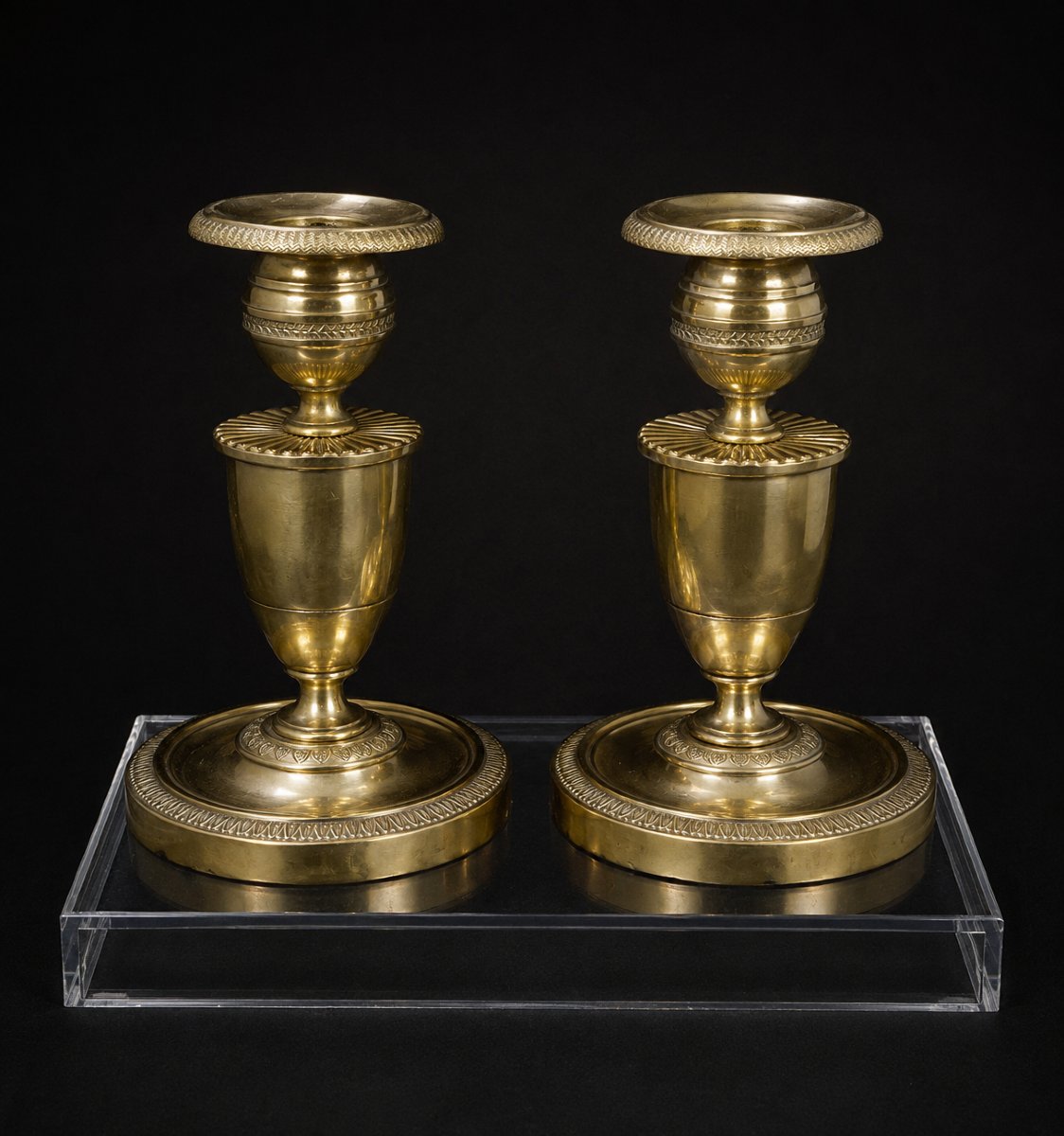Paire de flambeaux en bronze poli — Époque Empire