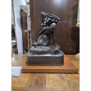 Sculpture en bronze d'Enrico Butti, « Il gerletto » (Le Porteur de hotte), fin du XIXe siècle.