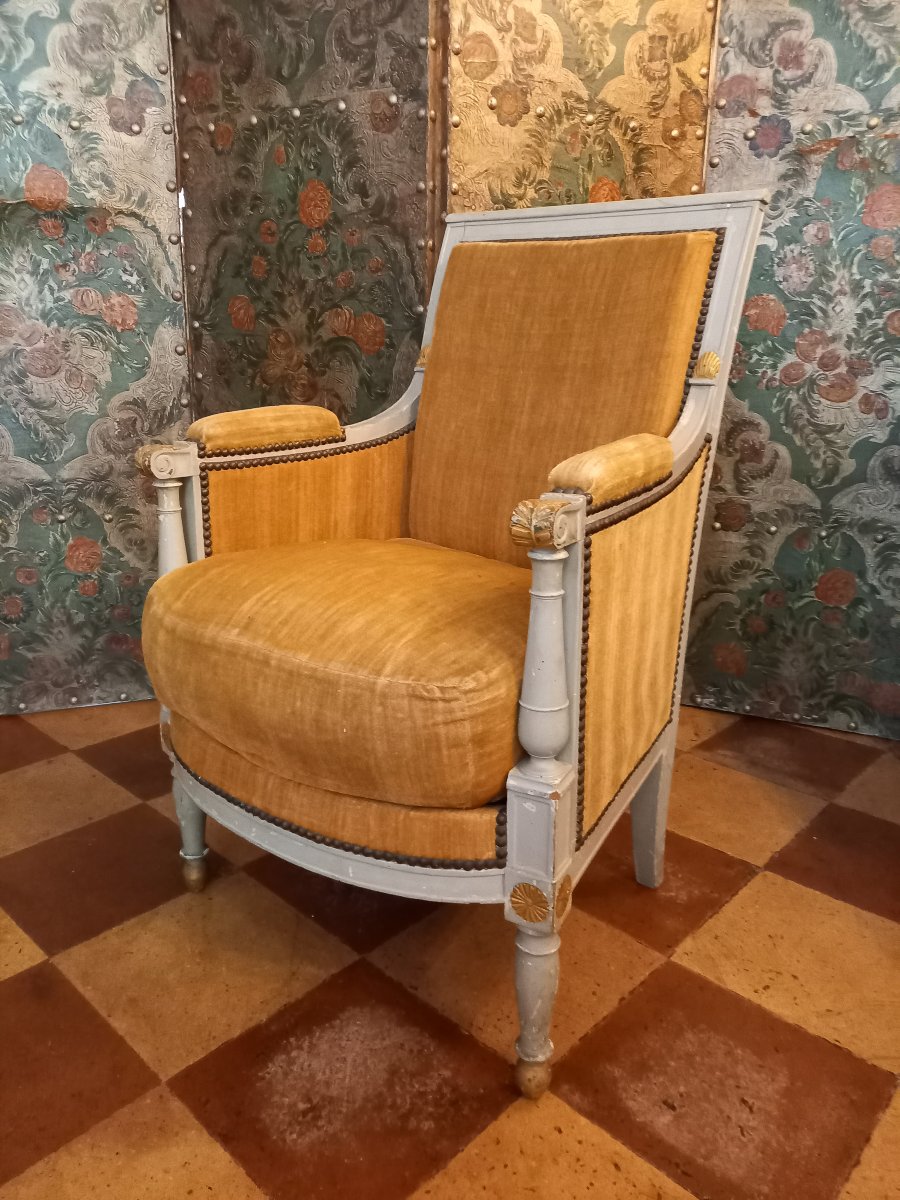 A Comfortable, Molded And Carved Wingback Chair, Reupholstered In Gray And Gold, From The Directoire-consulat Period