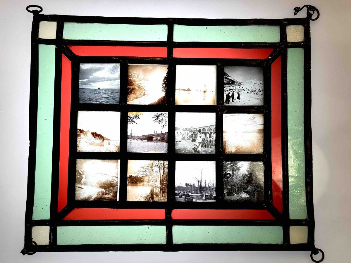 12 Photographies sur verre "paysages "  encadrement vitrail circa 1920