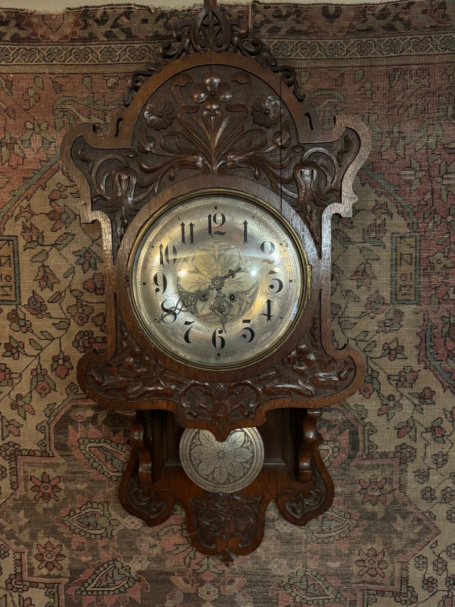 Pendule murale en bois sculpté, Allemagne , 19e S.