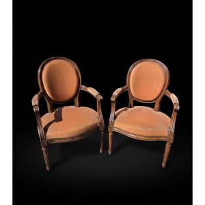 Paire de fauteuils cabriolets style Louis XVI (XXe siècle)