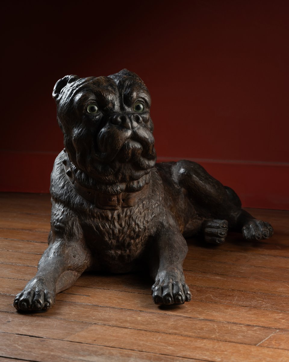 A Painted Reclining terracotta pug With Sulphide Eyes