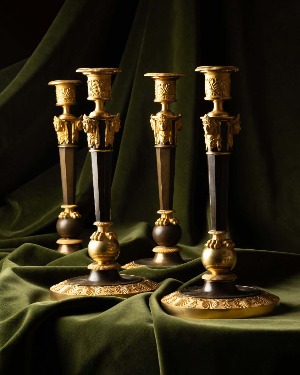 A Set Of Four Empire Parcel-gilt “claw-foot” Candlesticks With Antique Masks