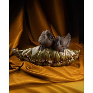 Couple de sarcelles sur une feuille de lotus