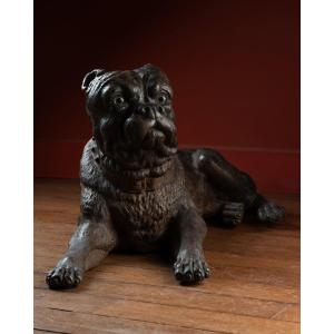 A Painted Reclining terracotta pug With Sulphide Eyes