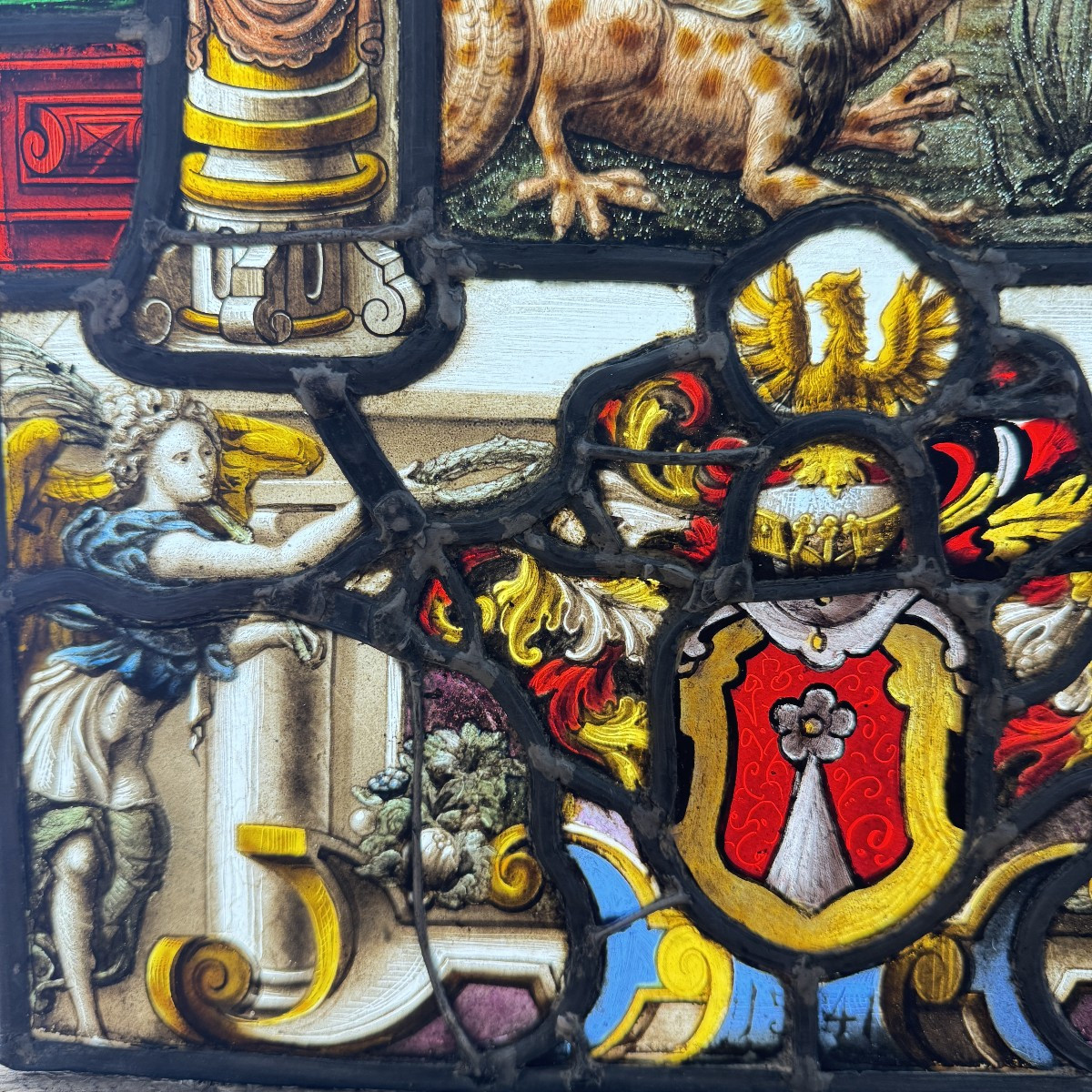 Stained Glass Window In The Renaissance Style Depicting Saint Michael Slaying The Dragon-photo-1