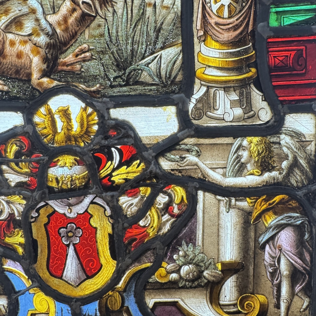 Stained Glass Window In The Renaissance Style Depicting Saint Michael Slaying The Dragon-photo-2