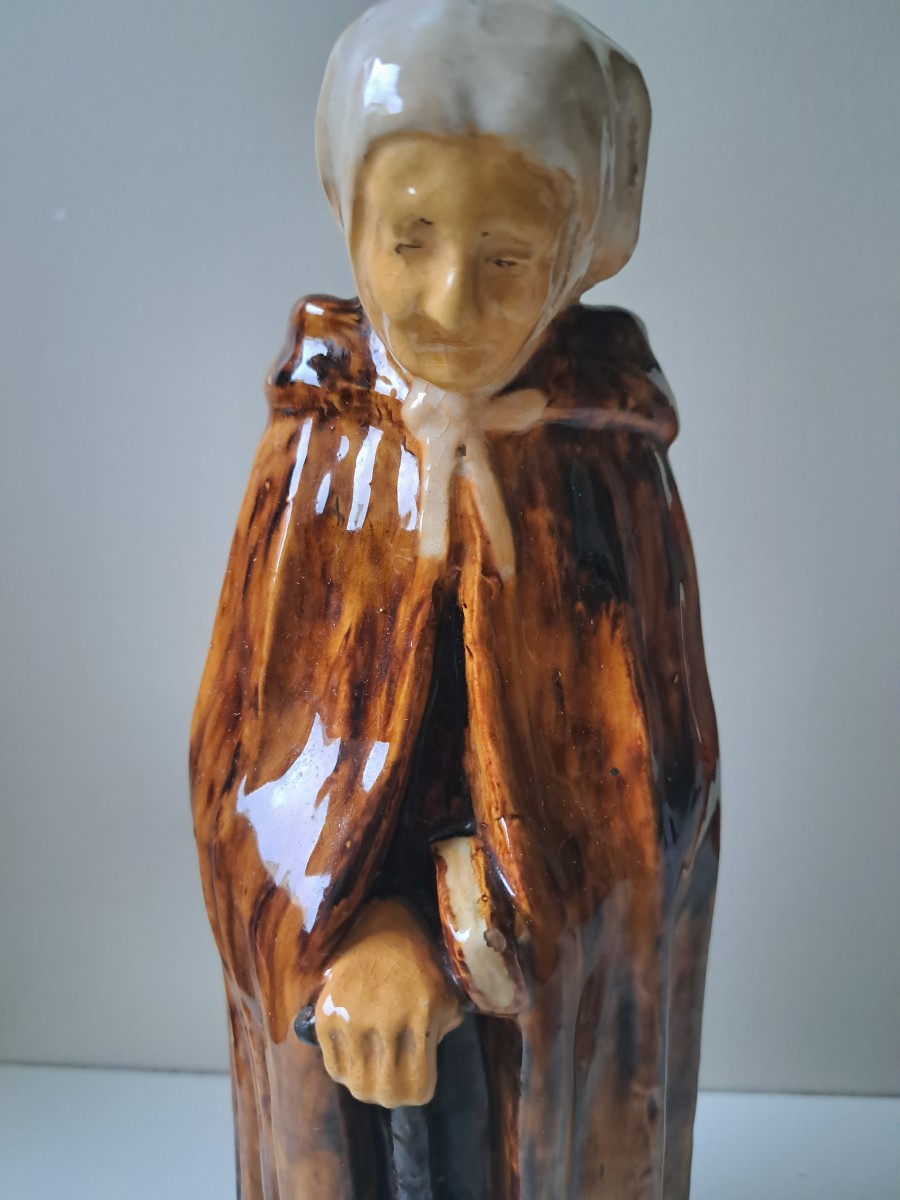 Old Woman In Ceramic Pottery From Bredeus 