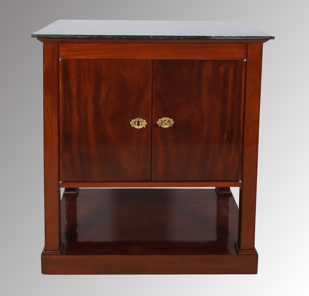 A Mahogany Writing Desk And Occasional Table From The Empire Period.