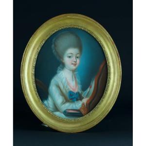 Pastel Painting Of A Young Girl In A Louis XVI-style Costume, Reading At A Dressing Table; Oval, Gilded Frame