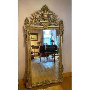 Large Louis XVI Mirror In Gilded And Carved Wood From The End Of The 18th Century.