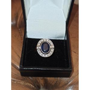 Art Deco Style Ring Adorned With A Bezel-set Sapphire In A Surrounding Of Brilliants 1950