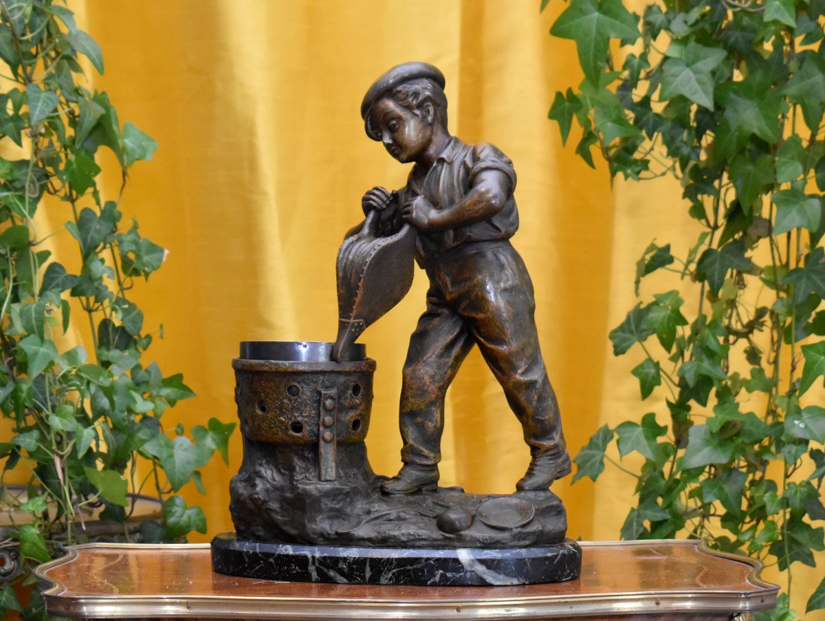 Statue Signed Grégoire, Spelter Sculpture Of A Young Boy With A Brazier And Bellows, Marble Base