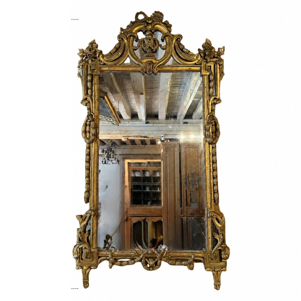 Importante glace d’époque Louis XVI en bois sculpté et doré