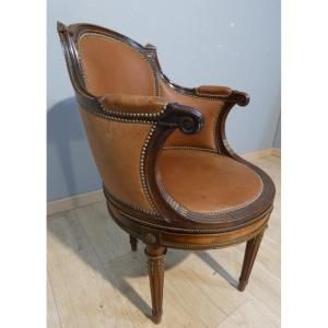 Fauteuil tournant de bureau style Louis XVI en acajou, bronze et cuir, époque début XX ème