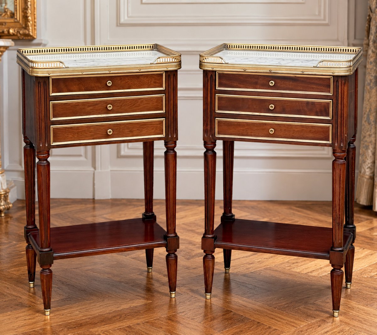Pair Of Mahogany Nightstands With Brass Details In The Louis XVI Style, With Marble Tops
