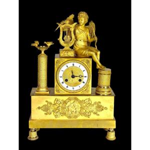 Empire Period Clock In Gilt Bronze Decorated With Eros Playing The Harp