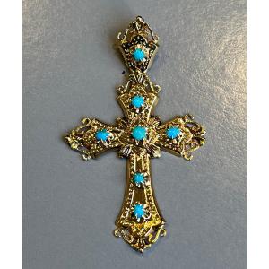 Croix en or avec bélière articulée sertie de 7 turquoises.