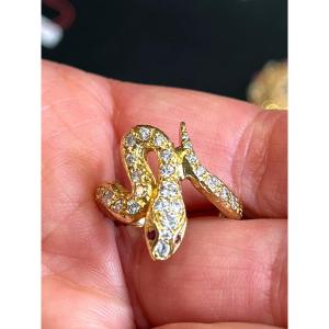 BAGUE SERPENT EN OR ET DIAMANTS.