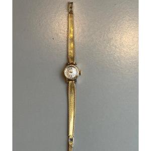 Montre bracelet or 18 carats pour dame.