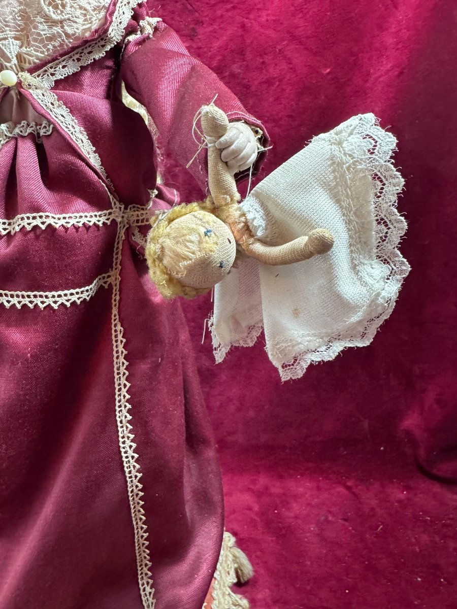 Robot Of A Young Girl Correcting Her Doll-photo-2