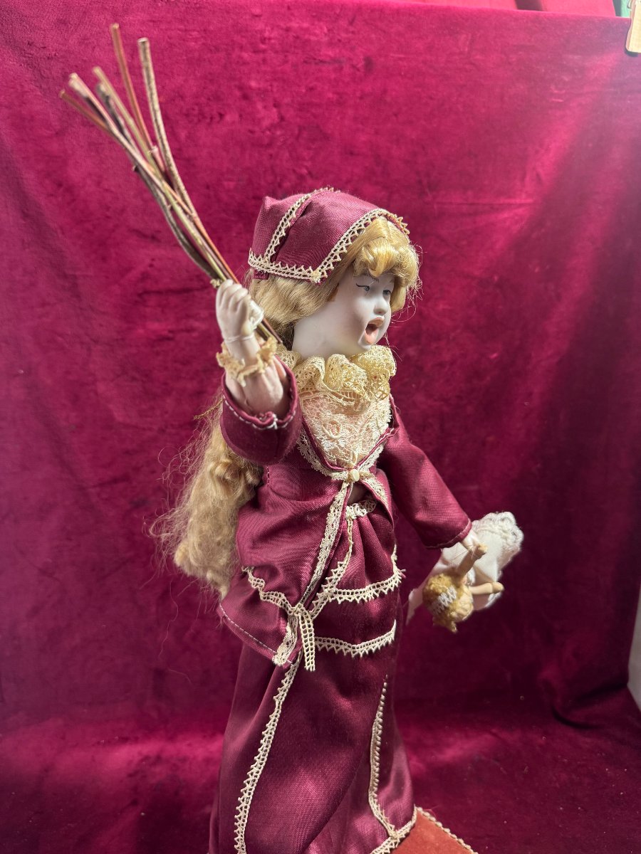 Robot Of A Young Girl Correcting Her Doll-photo-2