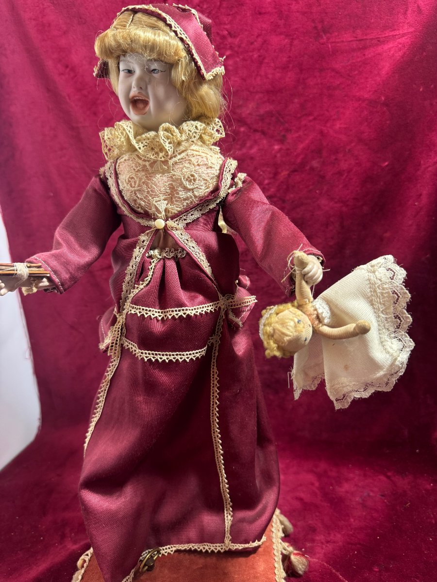 Robot Of A Young Girl Correcting Her Doll-photo-3