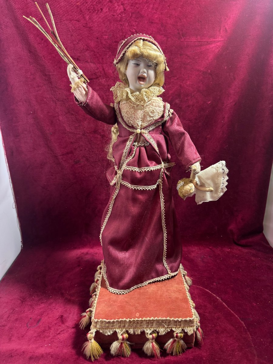 Robot Of A Young Girl Correcting Her Doll