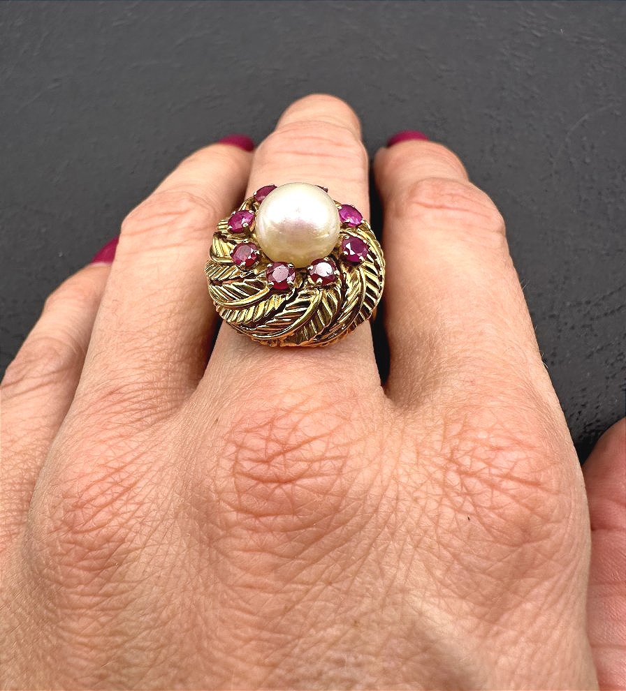 A Yellow Gold Ring Featuring A Cultured Pearl Set In The Center, Surrounded By Treated Rubies.-photo-2