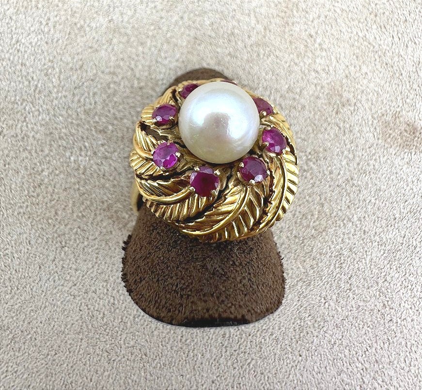A Yellow Gold Ring Featuring A Cultured Pearl Set In The Center, Surrounded By Treated Rubies.-photo-2