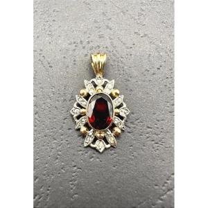 Pendentif ancien en or et argent avec un grenat central