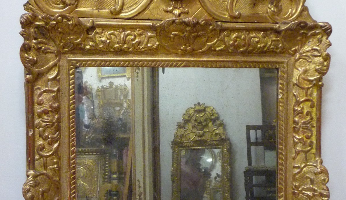 Louis XIV Period Mirror In Carved And Gilded Wood